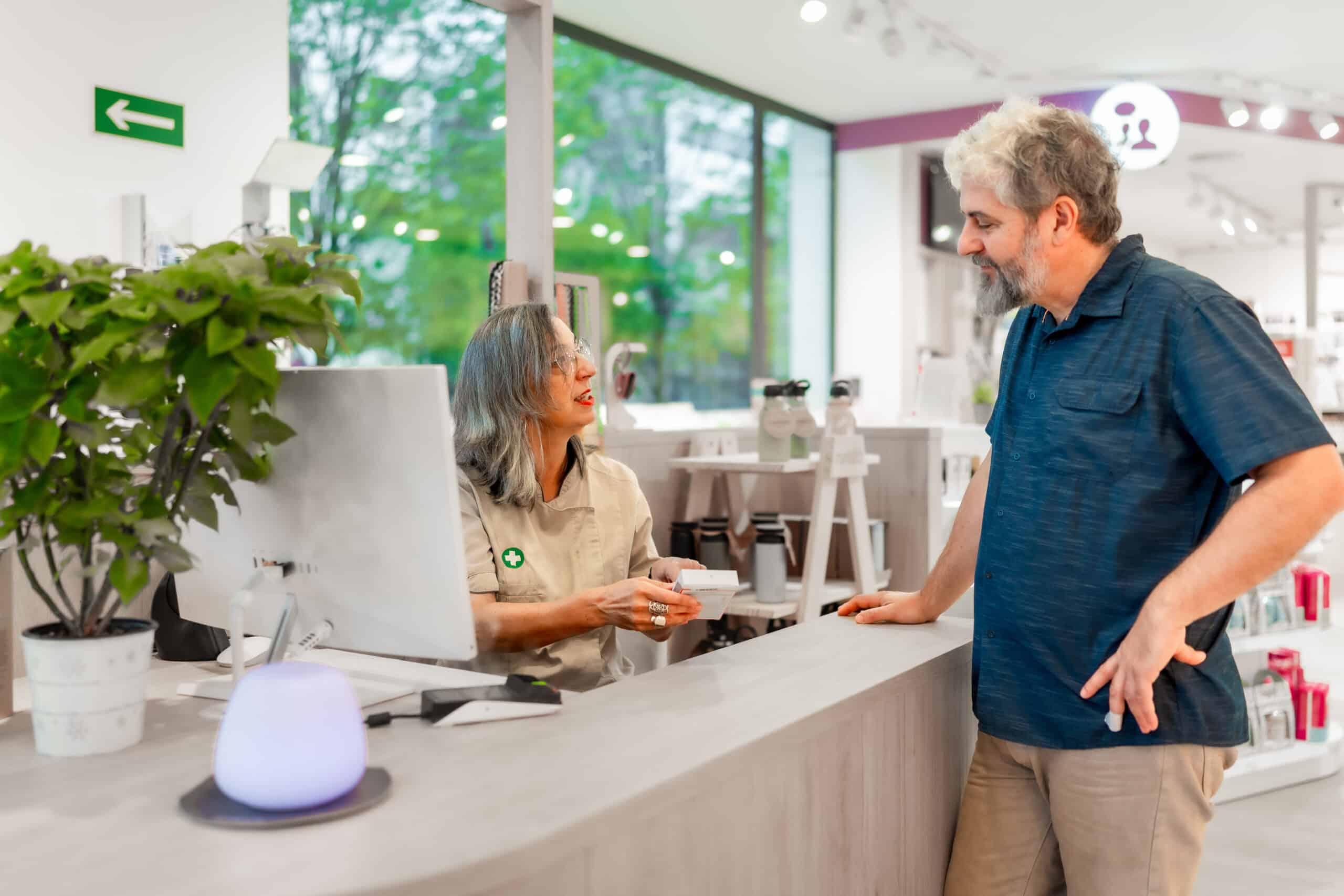 pharmacist talking to customer