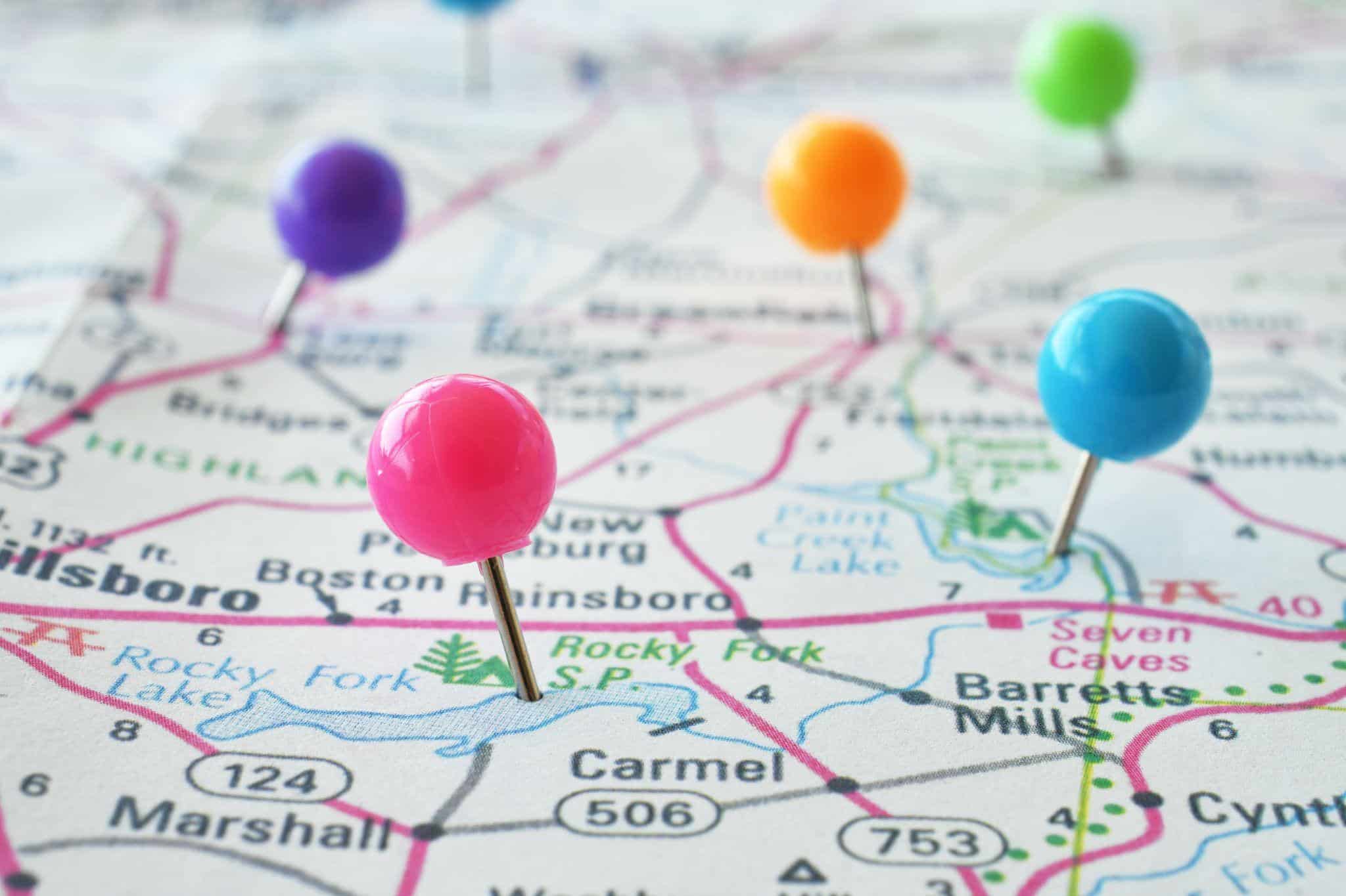 colorful push pins on a map